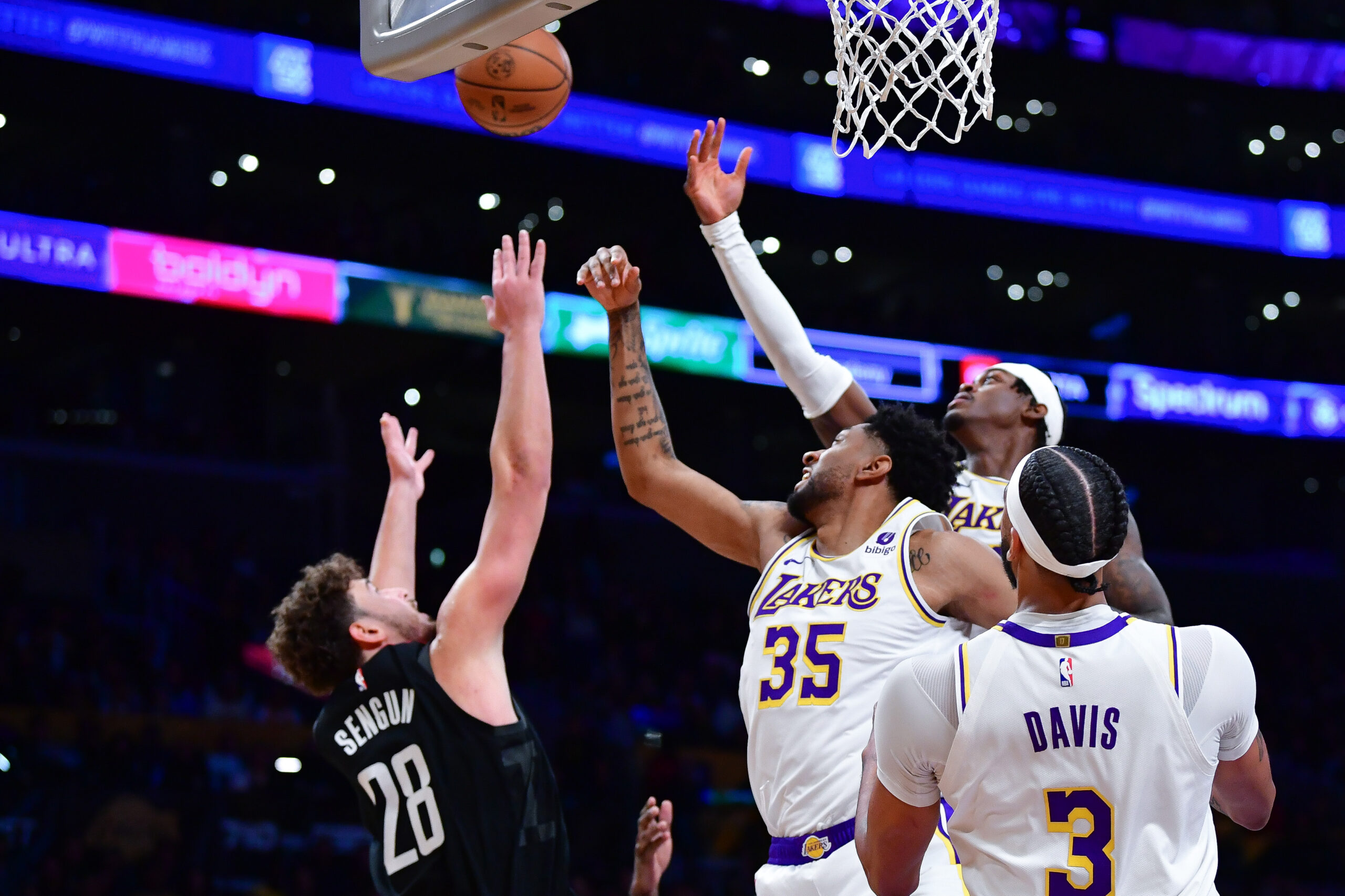 Dec 2, 2023; Los Angeles, California, USA; Los Angeles Lakers forward Christian Wood (35) and forward Jarred Vanderbilt (2) play for the rebound against Houston Rockets center Alperen Sengun (28) during the first half at Crypto.com Arena. Mandatory Credit: Gary A. Vasquez-USA TODAY Sports