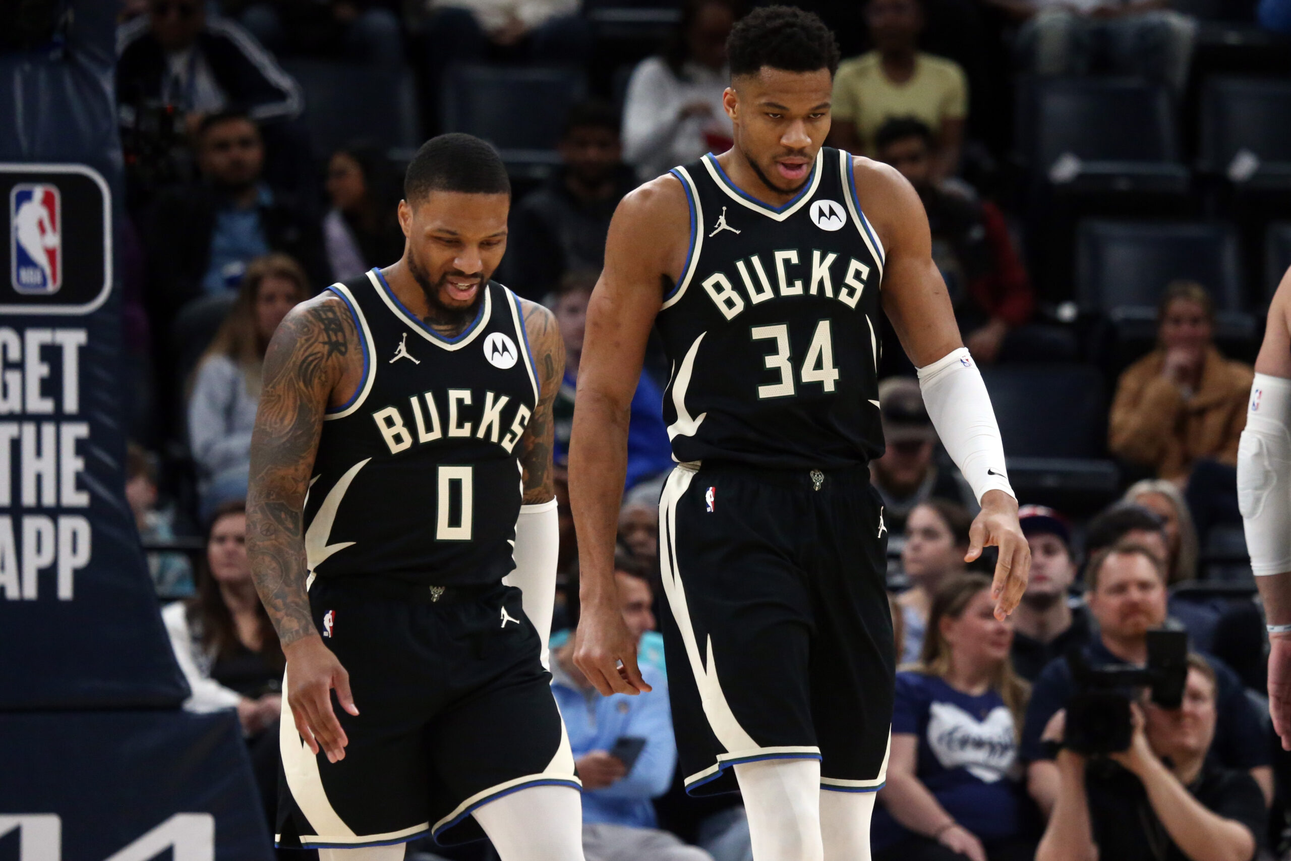 Feb 15, 2024; Memphis, Tennessee, USA; Milwaukee Bucks guard Damian Lillard (0) and forward Giannis Antetokounmpo (34) look on during the first half against the Memphis Grizzlies at FedExForum. Mandatory Credit: Petre Thomas-USA TODAY Sports