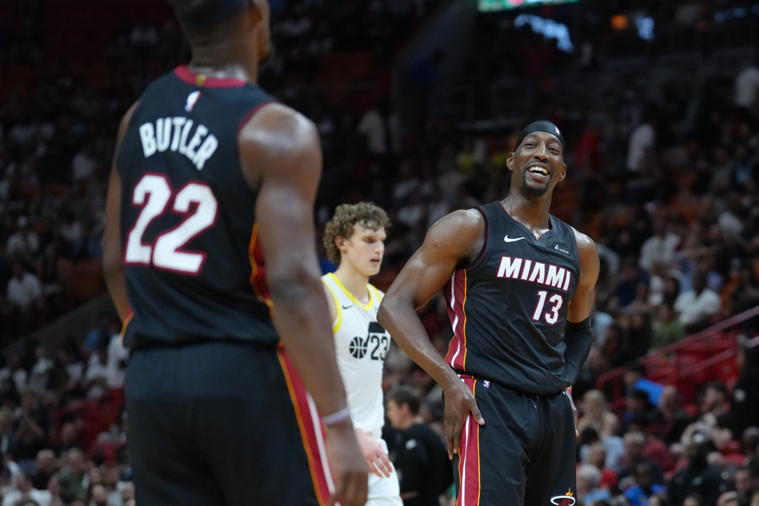 Mar 2, 2024; Miami, Florida, USA; Miami Heat center Bam Adebayo (13) shares a laugh with Miami Heat forward Jimmy Butler (22) in the fourth quarter at Kaseya Center. Mandatory Credit: Peter Joneleit-USA TODAY Sports