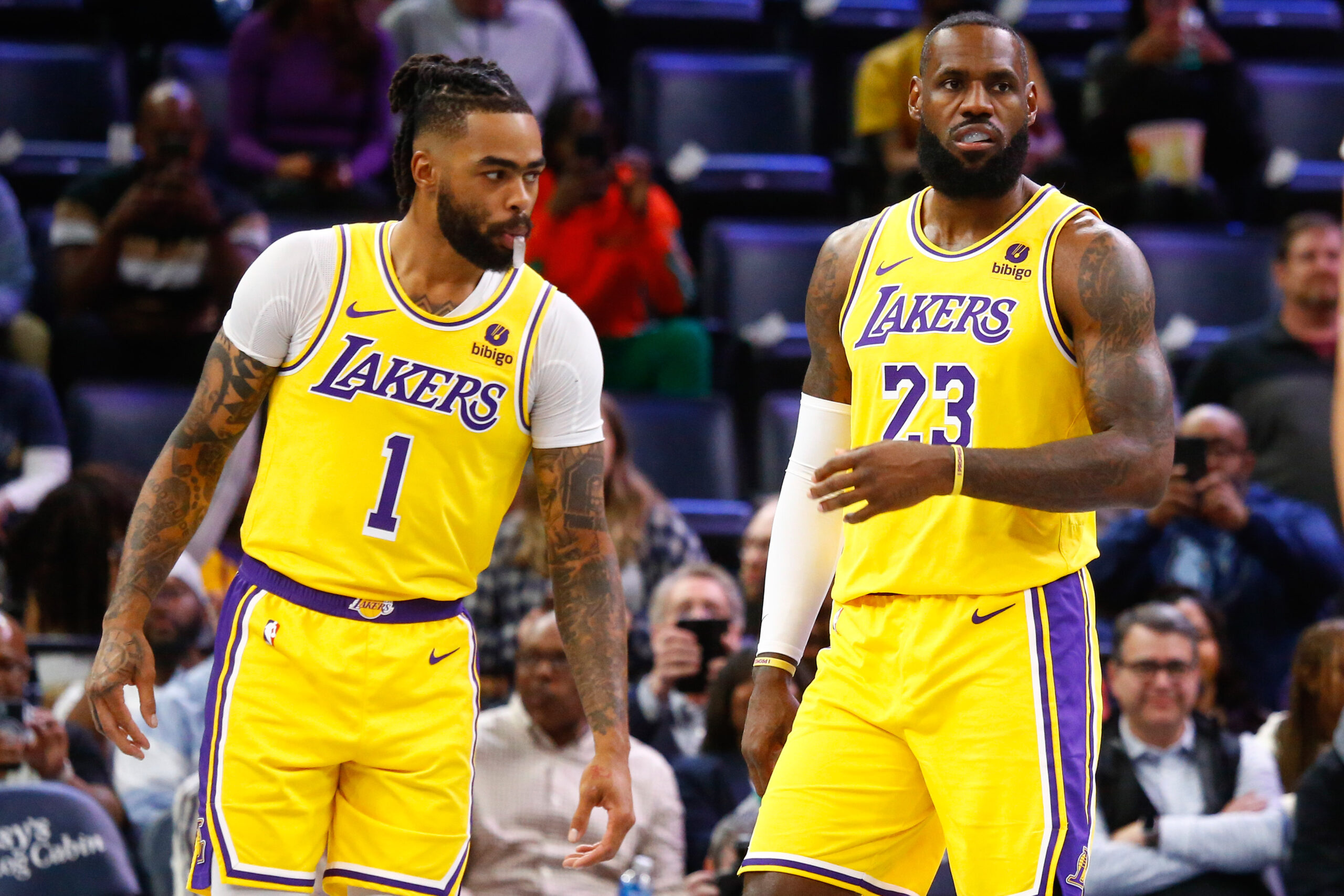 Mar 27, 2024; Memphis, Tennessee, USA; Los Angeles Lakers guard D'Angelo Russell (1) and forward LeBron James (23) wait for play to start against the Memphis Grizzlies at FedExForum. Mandatory Credit: Petre Thomas-USA TODAY Sports