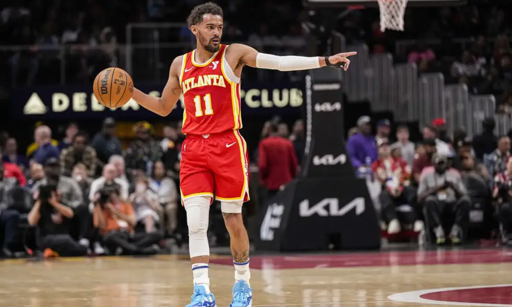 Apr 10, 2024; Atlanta, Georgia, USA; Atlanta Hawks guard Trae Young (11) points to a teammate against the Charlotte Hornets during the first half at State Farm Arena. Mandatory Credit: Dale Zanine-USA TODAY Sports