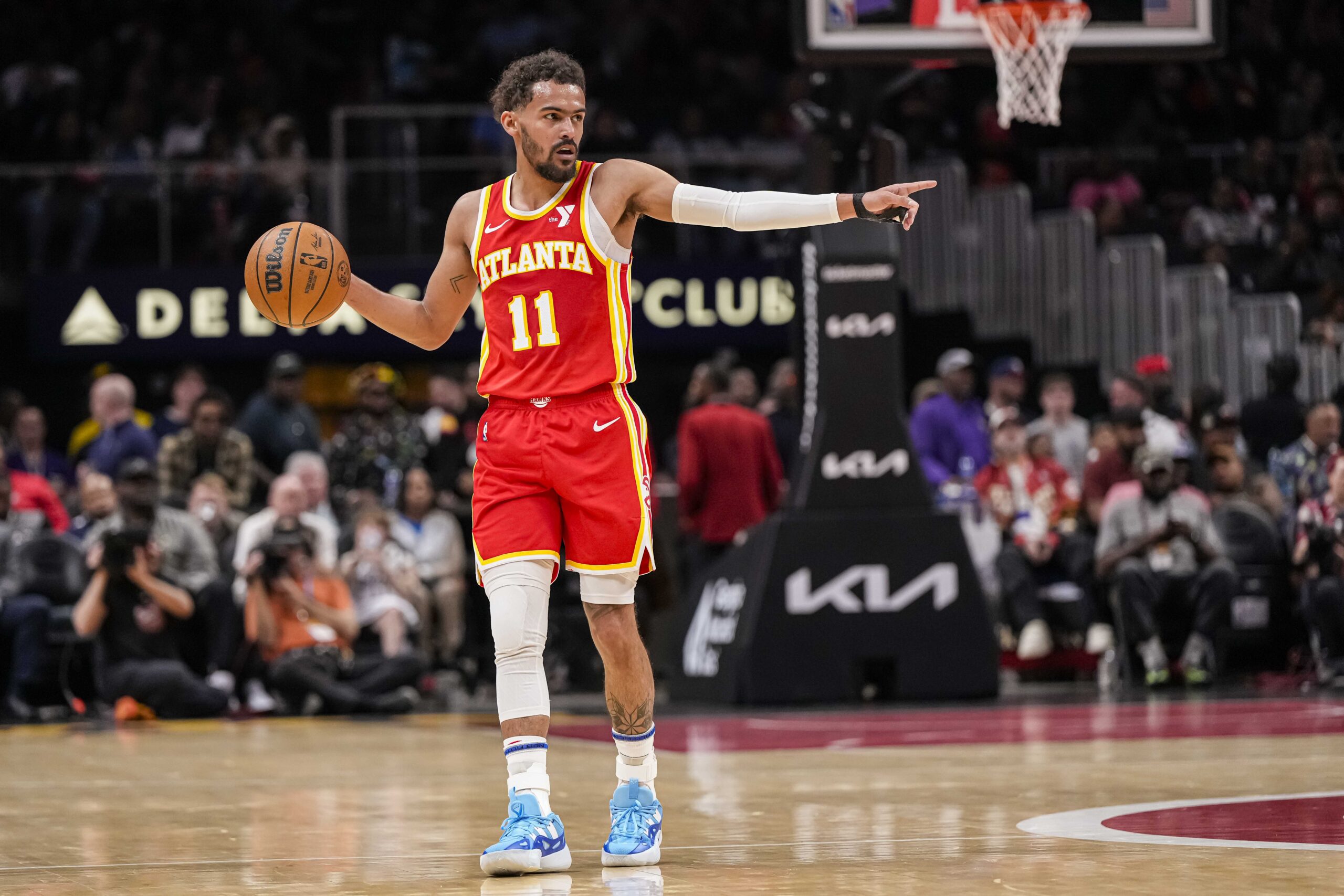 Apr 10, 2024; Atlanta, Georgia, USA; Atlanta Hawks guard Trae Young (11) points to a teammate against the Charlotte Hornets during the first half at State Farm Arena. Mandatory Credit: Dale Zanine-USA TODAY Sports