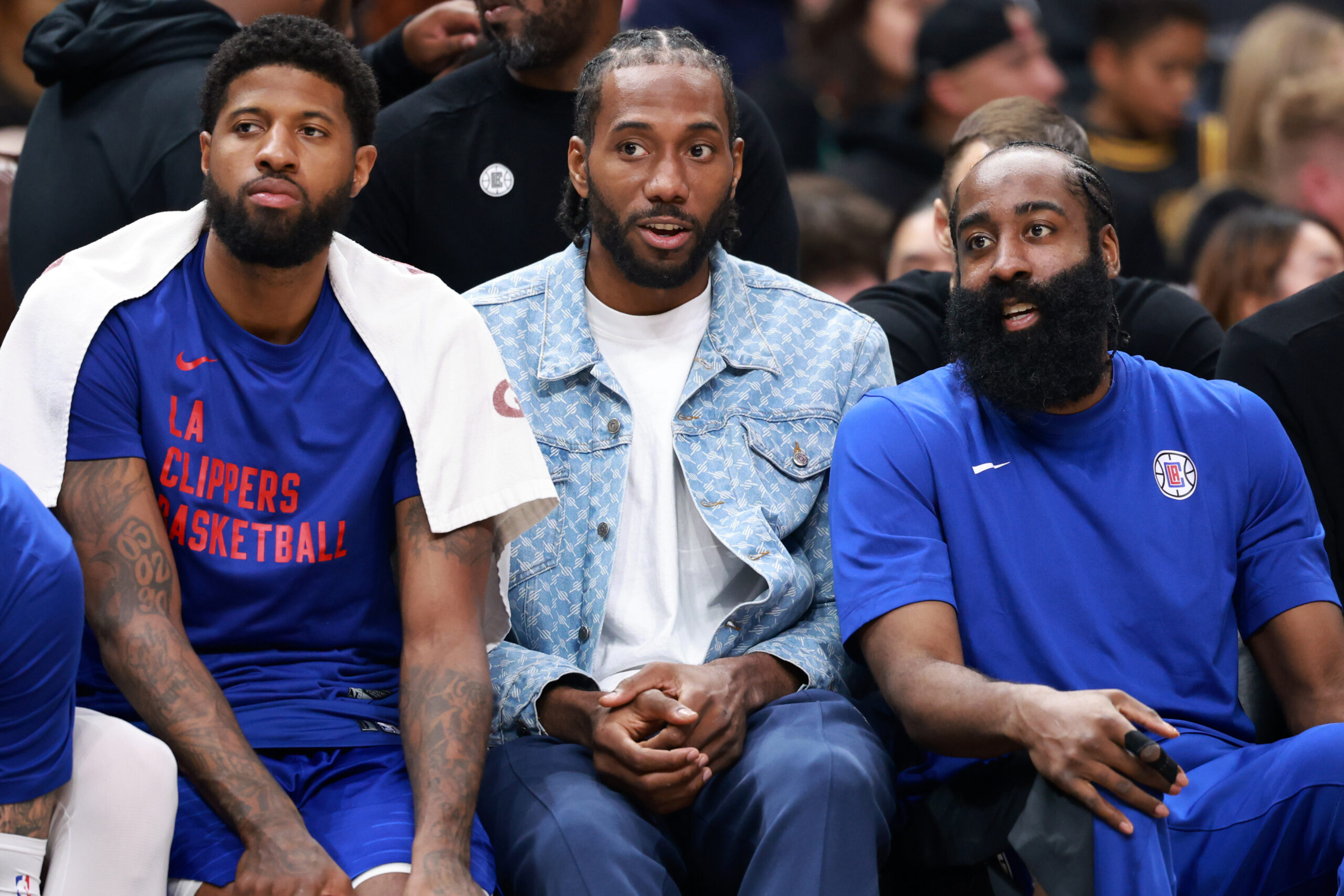 Apr 12, 2024; Los Angeles, California, USA; Los Angeles Clippers forward Paul George (13, left) and forward Kawhi Leonard (2, center) and guard James Harden (1, right) watch the game from the bench during the third quarter against the Utah Jazz at Crypto.com Arena. Mandatory Credit: Kiyoshi Mio-USA TODAY Sports
