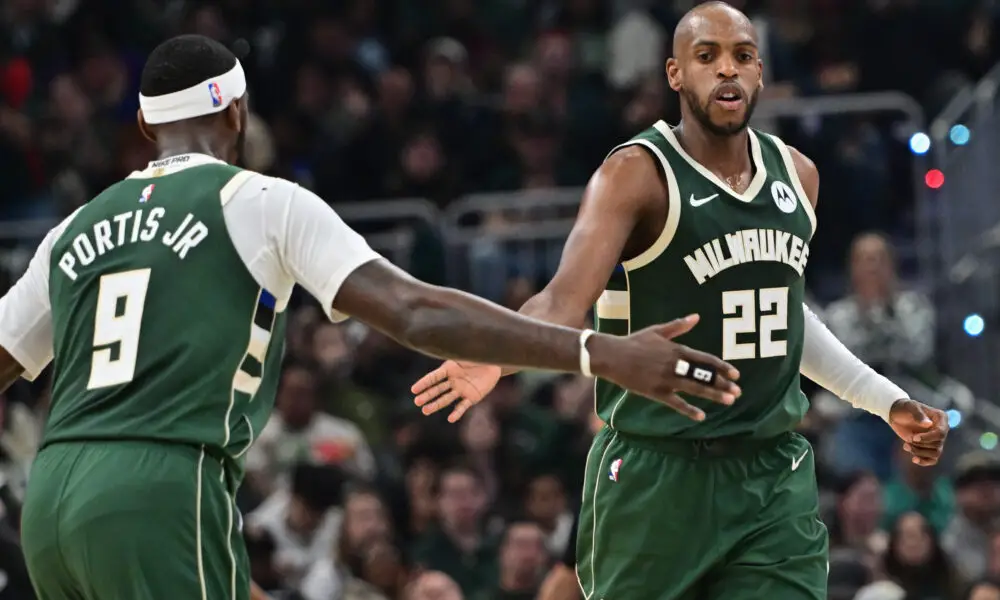 Apr 21, 2024; Milwaukee, Wisconsin, USA;Milwaukee Bucks forward Khris Middleton (22) is greeted by forward Bobby Portis (9) after scoring a basket in the second quarter against the Indiana Pacers during game one of the first round for the 2024 NBA playoffs at Fiserv Forum. Mandatory Credit: Benny Sieu-USA TODAY Sports