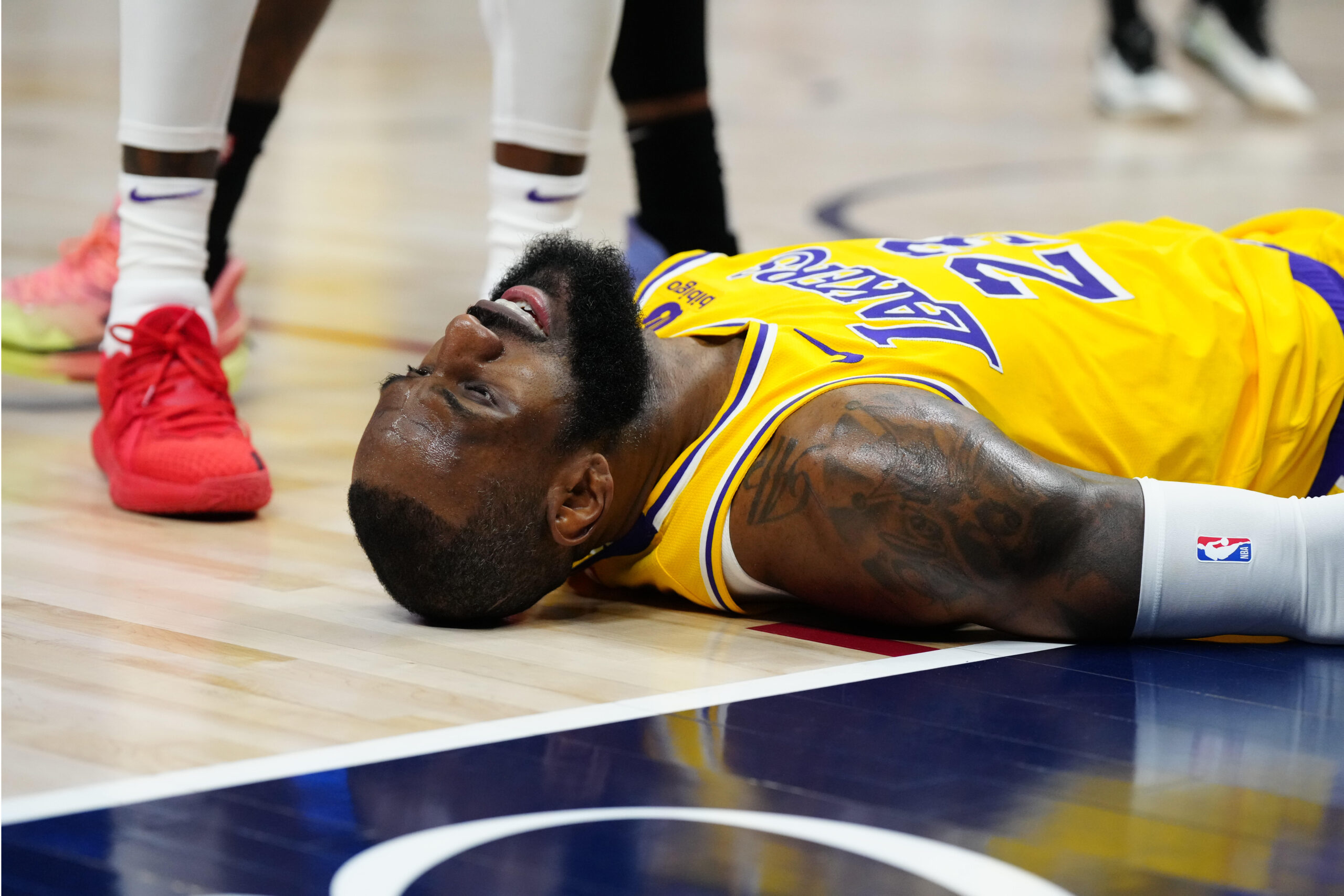 Apr 22, 2024; Denver, Colorado, USA; Los Angeles Lakers forward LeBron James (23) lays on the court in the second quarter against the Denver Nuggets during game two of the first half during the 2024 NBA playoffs at Ball Arena. Mandatory Credit: Ron Chenoy-USA TODAY Sports