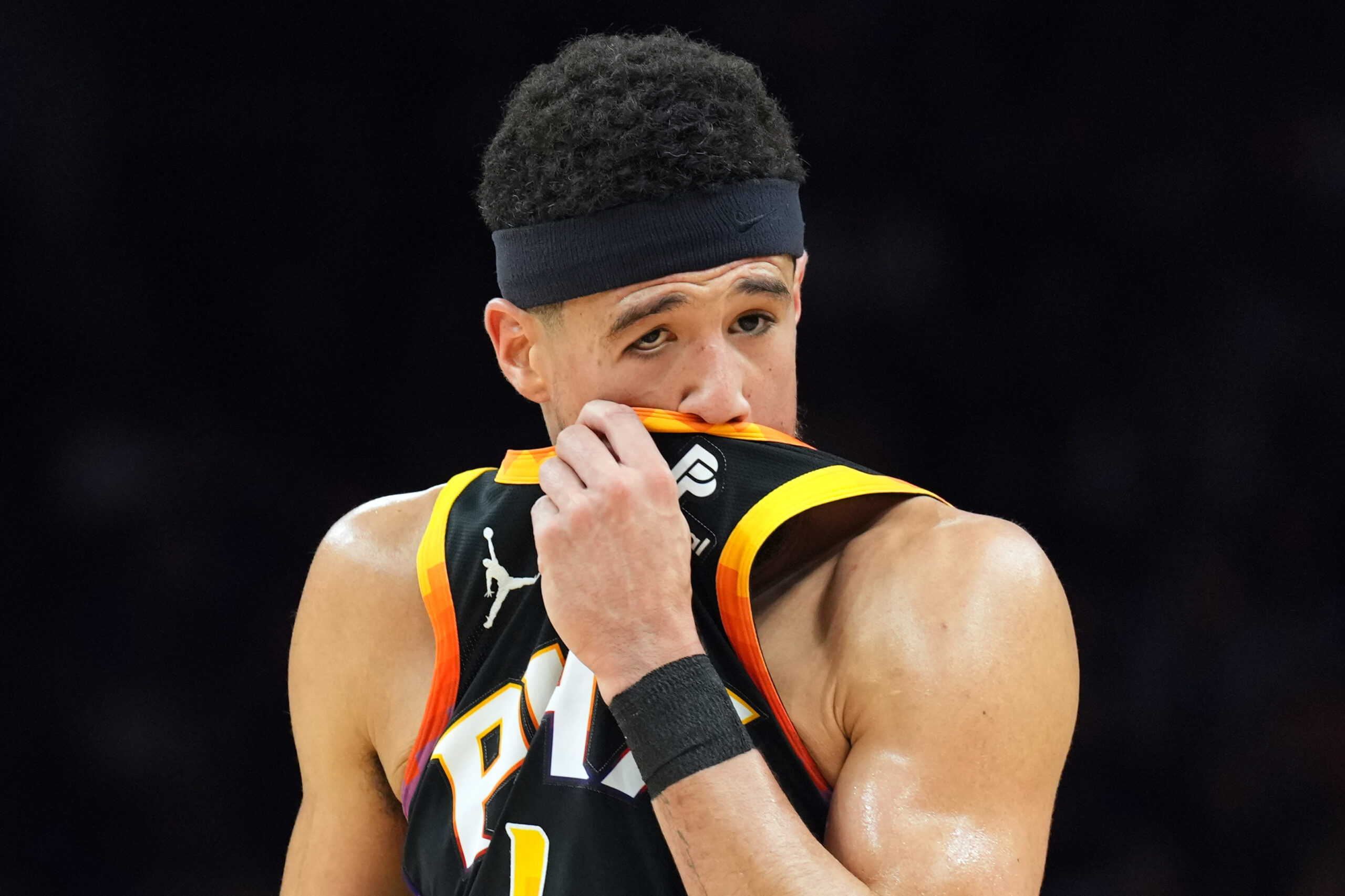 Apr 28, 2024; Phoenix, Arizona, USA; Phoenix Suns guard Devin Booker (1) reacts against the Minnesota Timberwolves during the first half of game four of the first round for the 2024 NBA playoffs at Footprint Center. Mandatory Credit: Joe Camporeale-USA TODAY Sports