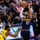 Apr 29, 2024; Denver, Colorado, USA; Denver Nuggets guard Jamal Murray (27) takes a shot against Los Angeles Lakers forward Rui Hachimura (28) in the fourth quarter during game five of the first round for the 2024 NBA playoffs at Ball Arena. Mandatory Credit: Isaiah J. Downing-USA TODAY Sports