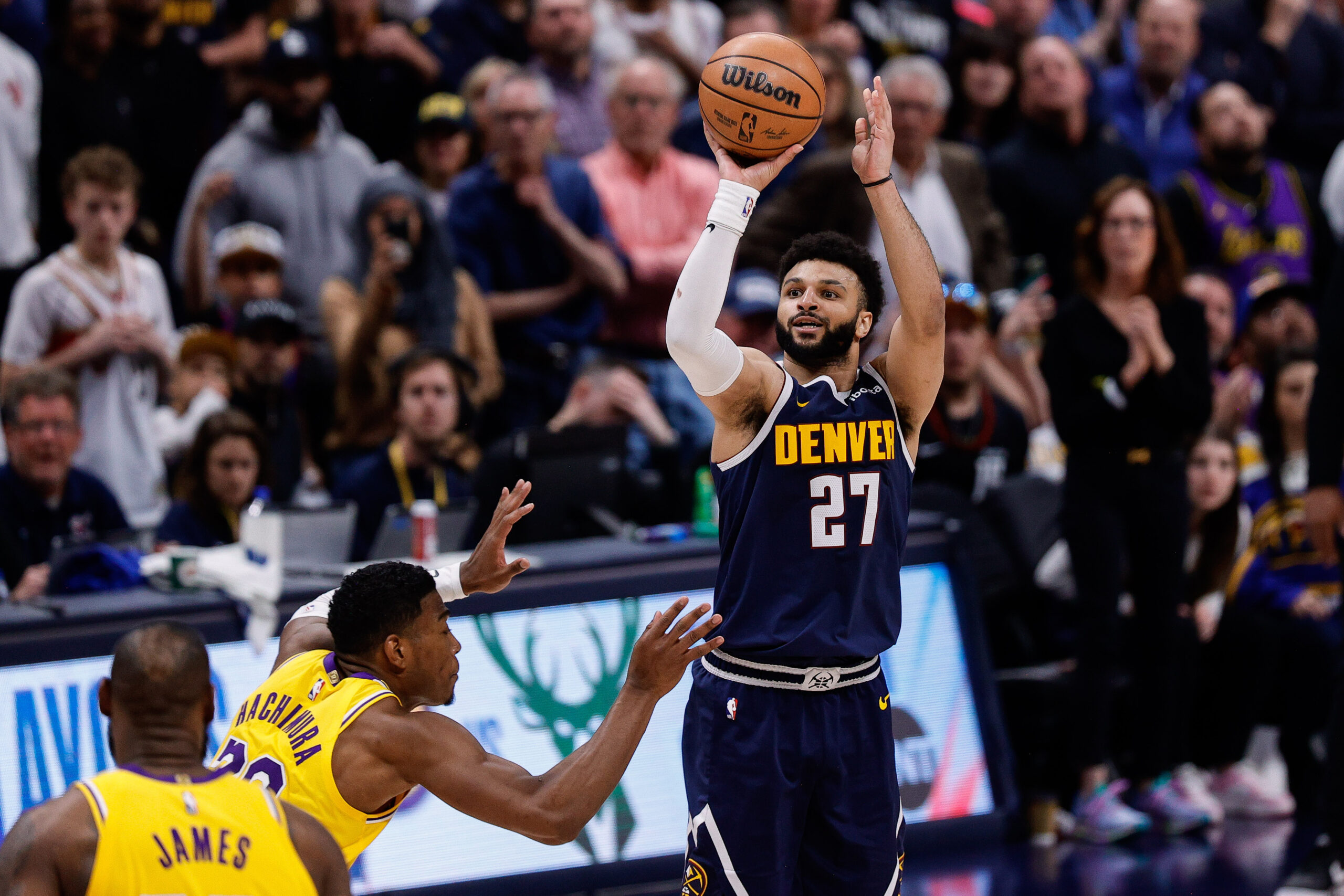 Apr 29, 2024; Denver, Colorado, USA; Denver Nuggets guard Jamal Murray (27) takes a shot against Los Angeles Lakers forward Rui Hachimura (28) in the fourth quarter during game five of the first round for the 2024 NBA playoffs at Ball Arena. Mandatory Credit: Isaiah J. Downing-USA TODAY Sports