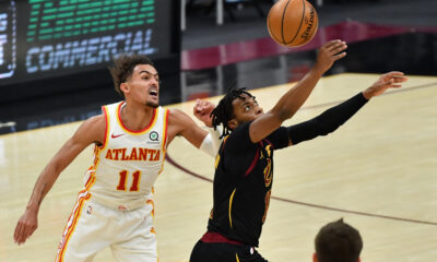 Feb 23, 2021; Cleveland, Ohio, USA; Cleveland Cavaliers guard Darius Garland (10) intercepts a pass intended for Atlanta Hawks guard Trae Young (11) during the third quarter at Rocket Mortgage FieldHouse. Mandatory Credit: Ken Blaze-USA TODAY Sports