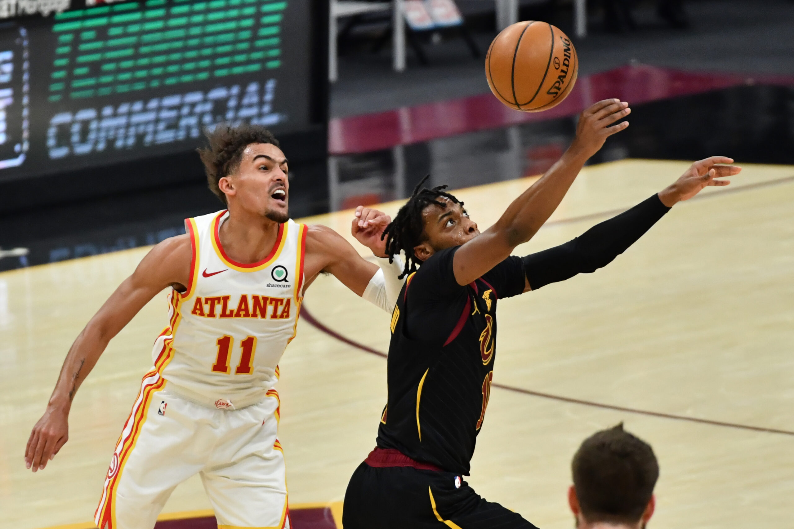 Feb 23, 2021; Cleveland, Ohio, USA; Cleveland Cavaliers guard Darius Garland (10) intercepts a pass intended for Atlanta Hawks guard Trae Young (11) during the third quarter at Rocket Mortgage FieldHouse. Mandatory Credit: Ken Blaze-USA TODAY Sports