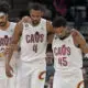 Jan 14, 2023; Minneapolis, Minnesota, USA; Cleveland Cavaliers forward Evan Mobley (4) is helped off the court by guard Donovan Mitchell (45) and center Jarrett Allen (31) during the second quarter at Target Center. Mandatory Credit: Jeffrey Becker-USA TODAY Sports
