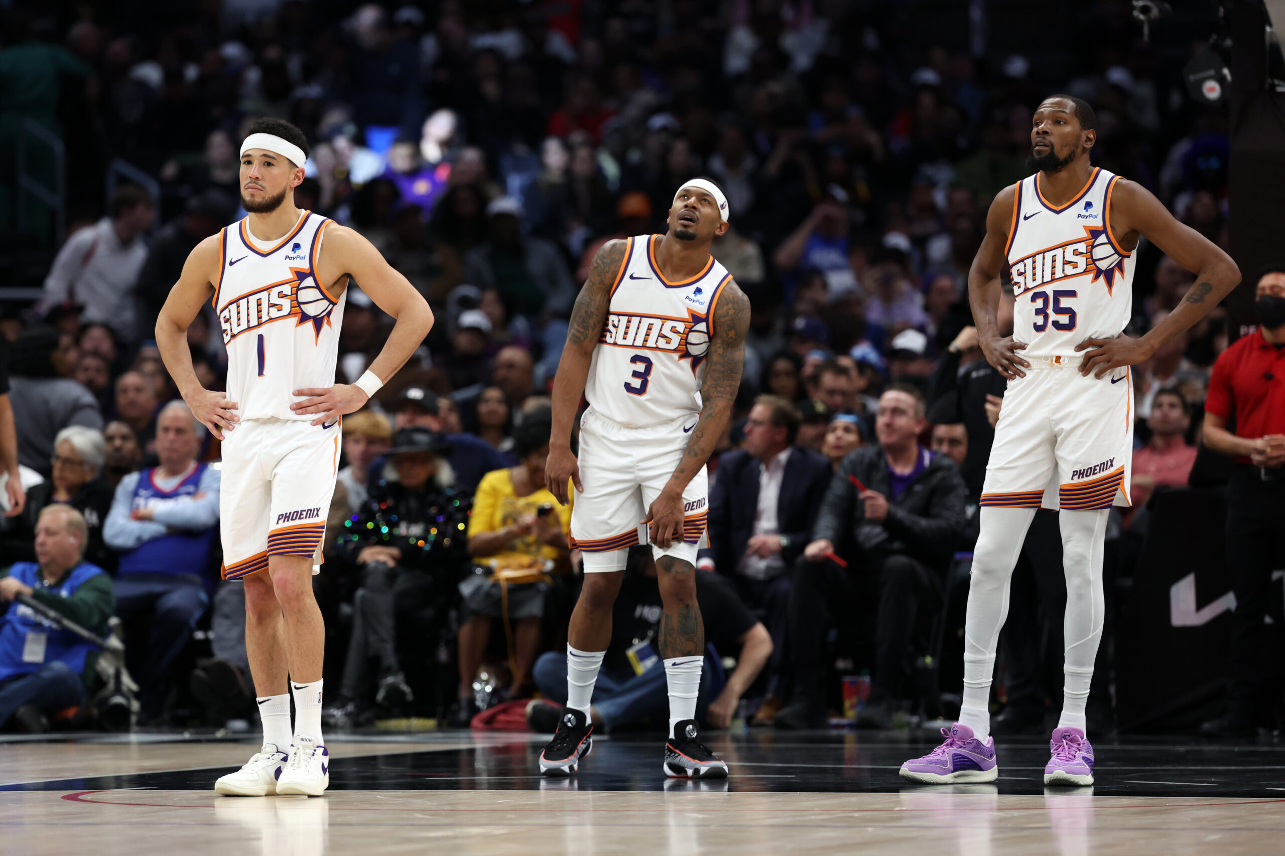 Jan 8, 2024; Los Angeles, California, USA; Phoenix Suns guard Devin Booker (1) and guard Bradley Beal (3) and forward Kevin Durant (35) stands on the floor during the fourth quarter against the Los Angeles Clippers at Crypto.com Arena. Mandatory Credit: Kiyoshi Mio-USA TODAY Sports