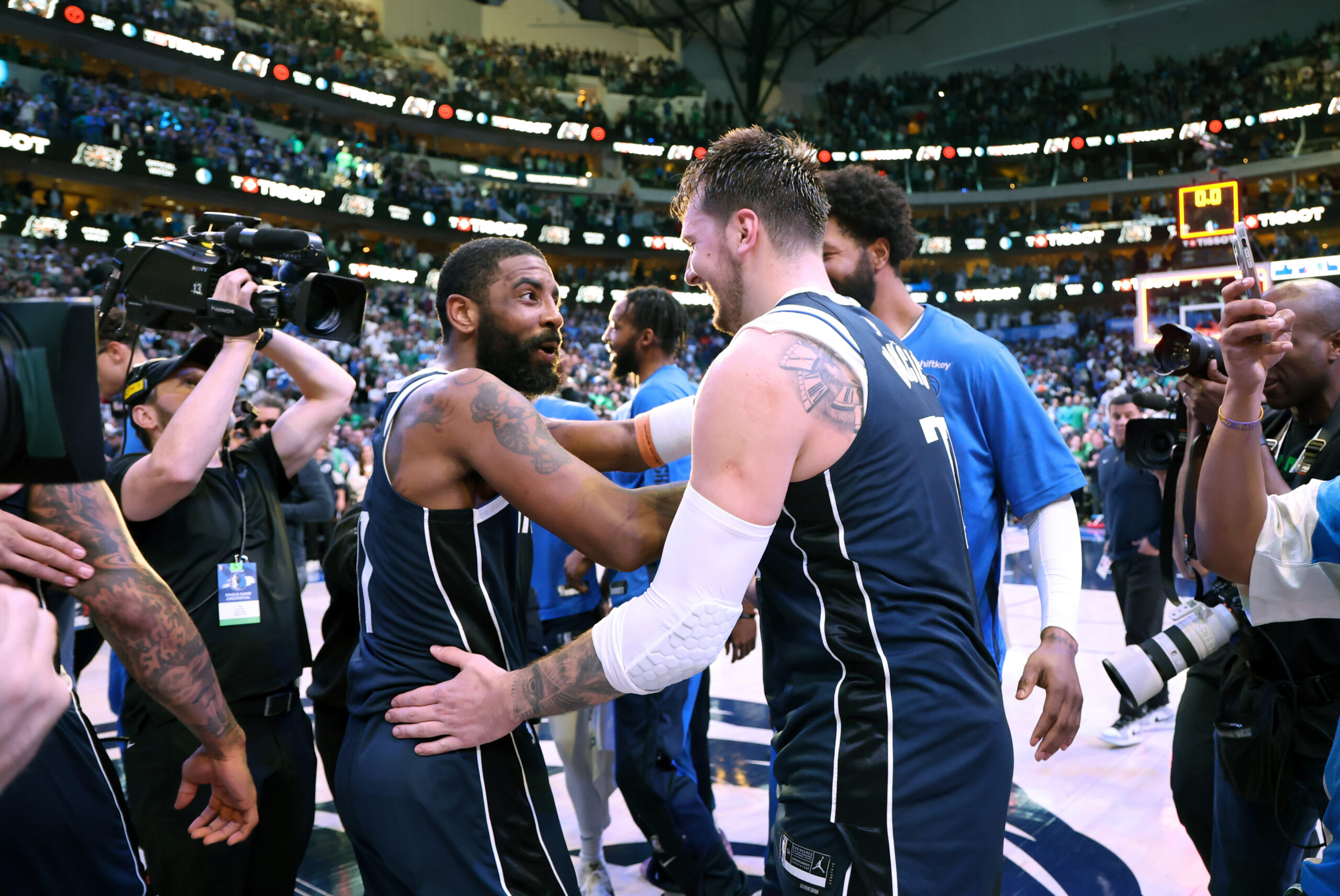 Mar 17, 2024; Dallas, Texas, USA; Dallas Mavericks guard Luka Doncic (77) celebrates with Dallas Mavericks guard Kyrie Irving (11) during the second half against the Denver Nuggets at American Airlines Center. Mandatory Credit: Kevin Jairaj-USA TODAY Sports