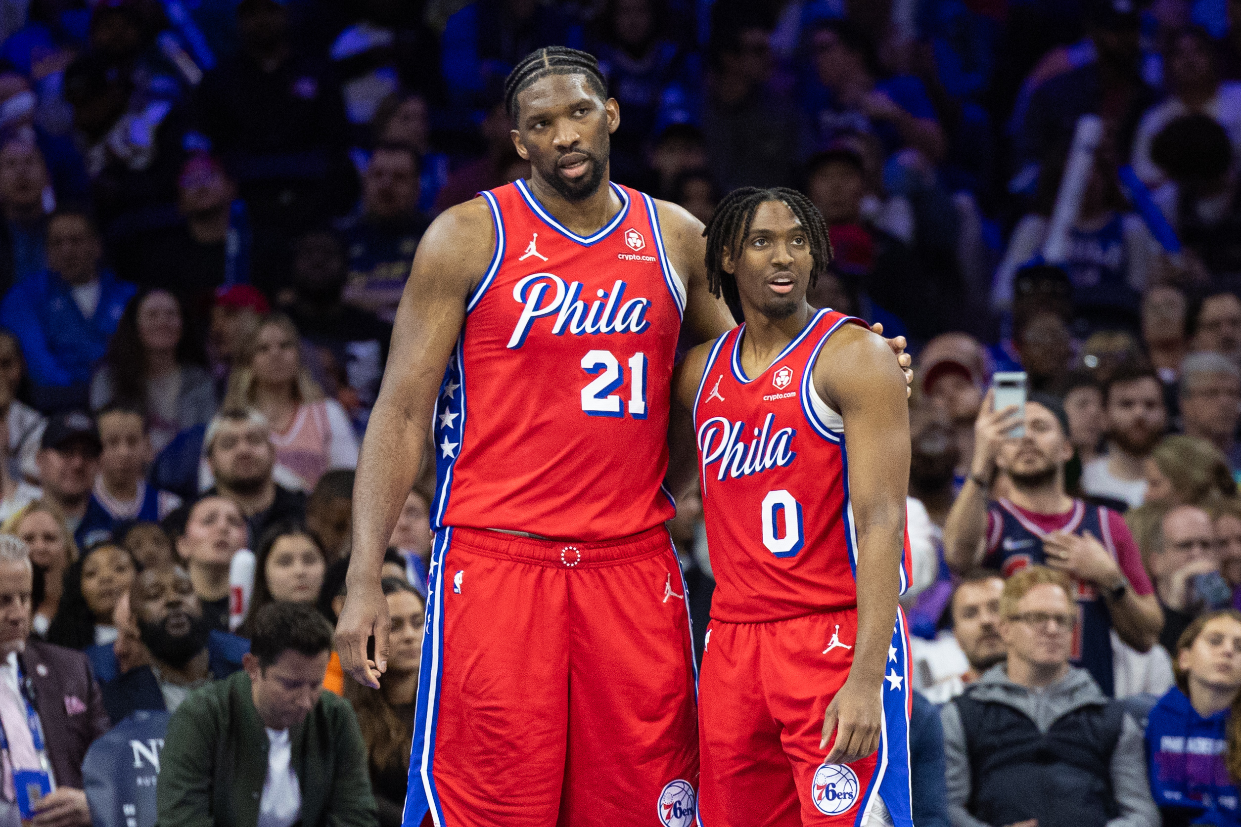 Apr 12, 2024; Philadelphia, Pennsylvania, USA; Philadelphia 76ers center Joel Embiid (21) and guard Tyrese Maxey (0) stand together during a break in action in the fourth quarter against the Orlando Magic at Wells Fargo Center. Mandatory Credit: Bill Streicher-USA TODAY Sports