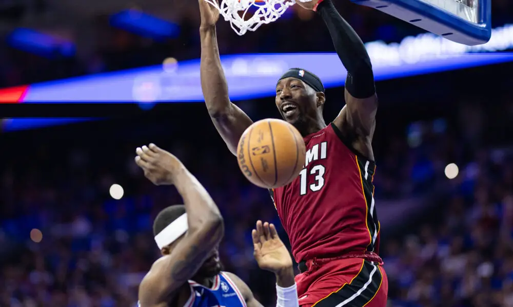 Apr 17, 2024; Philadelphia, Pennsylvania, USA; Miami Heat center Bam Adebayo (13) dunks the ball over Philadelphia 76ers forward Paul Reed (44) during the second quarter of a play-in game of the 2024 NBA playoffs at Wells Fargo Center. Mandatory Credit: Bill Streicher-USA TODAY Sports