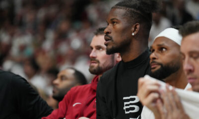 Apr 27, 2024; Miami, Florida, USA; Miami Heat forward Jimmy Butler (22) looks on from the bench against the Boston Celtics in the first half during game three of the first round for the 2024 NBA playoffs at Kaseya Center. Mandatory Credit: Jim Rassol-USA TODAY Sports