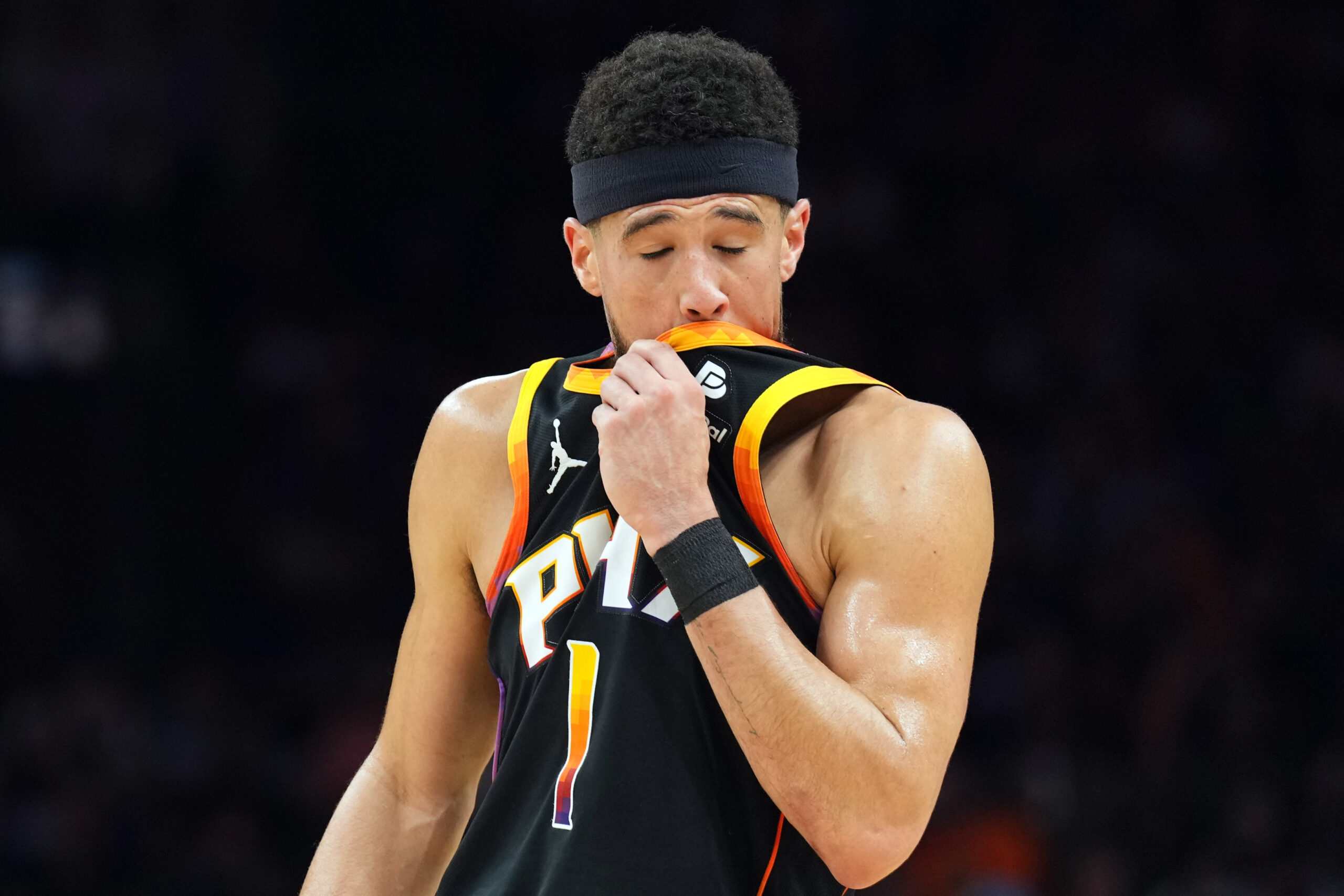Apr 28, 2024; Phoenix, Arizona, USA; Phoenix Suns guard Devin Booker (1) reacts against the Minnesota Timberwolves during the first half of game four of the first round for the 2024 NBA playoffs at Footprint Center. Mandatory Credit: Joe Camporeale-USA TODAY Sports