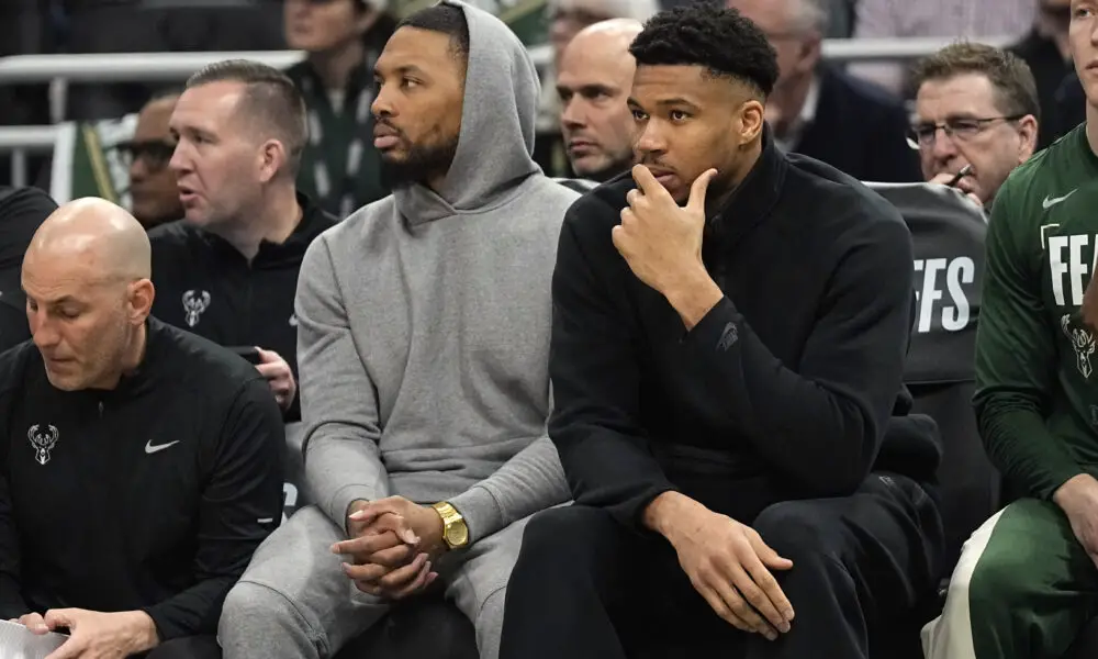 Apr 30, 2024; Milwaukee, Wisconsin, USA; Milwaukee Bucks guard Damian Lillard and forward Giannis Antetokounmpo watch from the bench during the first quarter during game five of the first round for the 2024 NBA playoffs against the Indiana Pacers at Fiserv Forum. Mandatory Credit: Jeff Hanisch-USA TODAY Sports