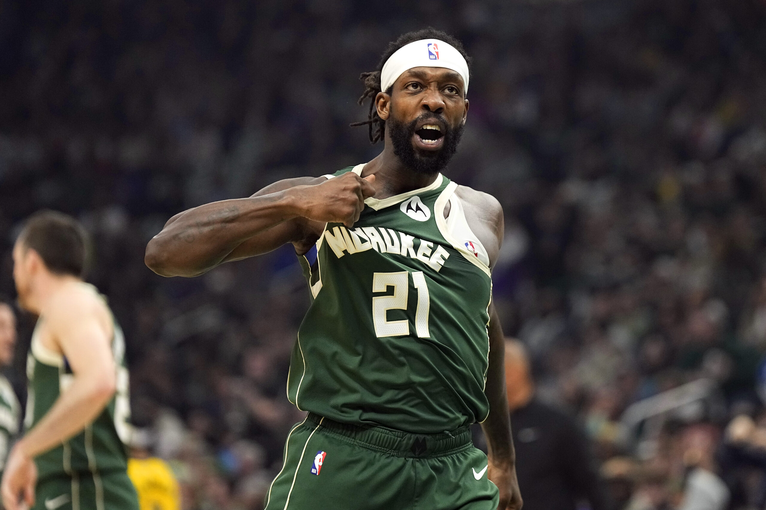 Apr 30, 2024; Milwaukee, Wisconsin, USA; Milwaukee Bucks guard Patrick Beverley (21) gestures towards the crowd following a play during the second quarter against the Indiana Pacers during game five of the first round for the 2024 NBA playoffs at Fiserv Forum. Mandatory Credit: Jeff Hanisch-USA TODAY Sports