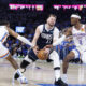 May 7, 2024; Oklahoma City, Oklahoma, USA; Dallas Mavericks guard Luka Doncic (77) has the ball stripped as he drives between Oklahoma City Thunder guard Shai Gilgeous-Alexander (2) and forward Jalen Williams (8) during the second half of game one of the second round for the 2024 NBA playoffs at Paycom Center. Mandatory Credit: Alonzo Adams-USA TODAY Sports