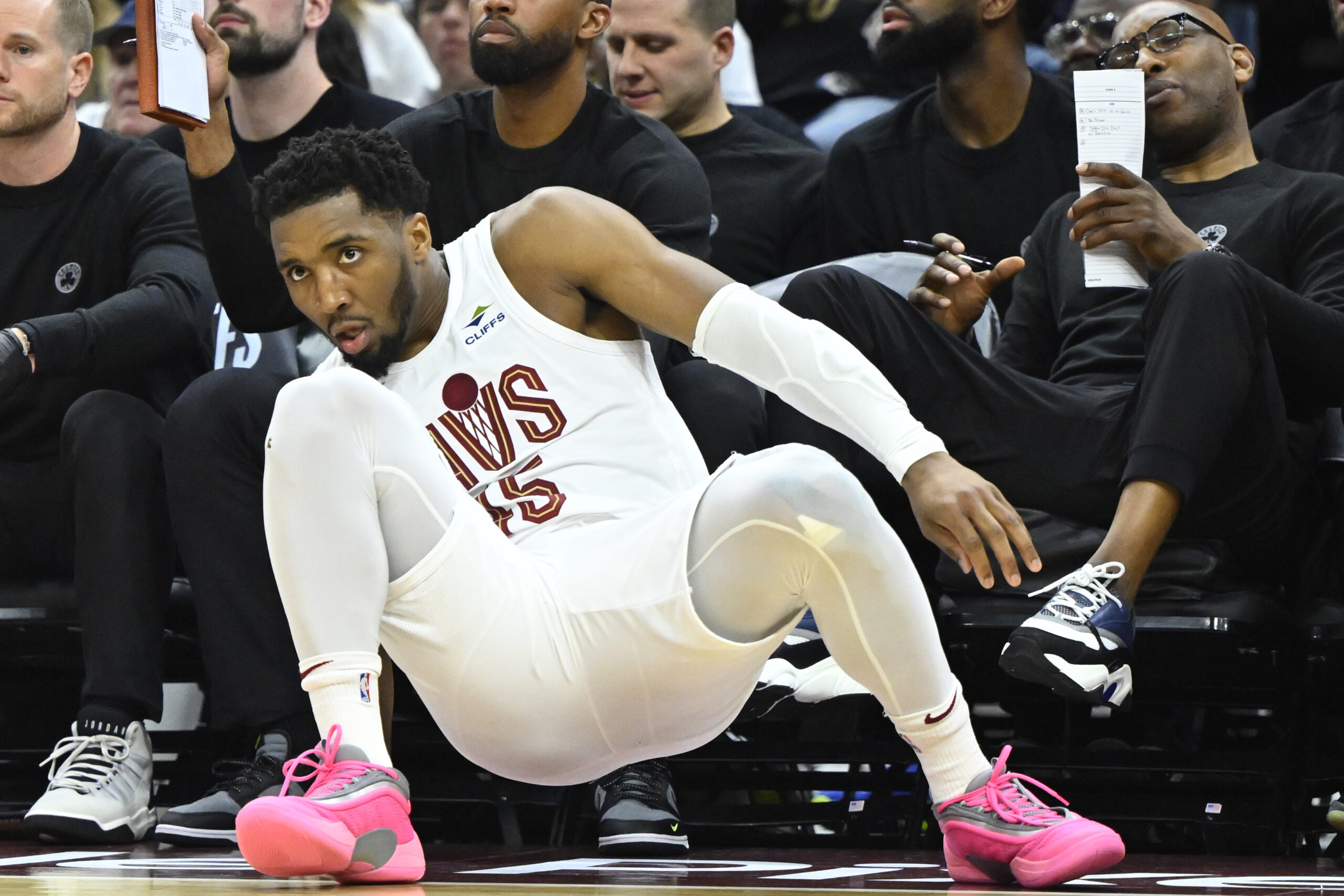 May 11, 2024; Cleveland, Ohio, USA; Cleveland Cavaliers guard Donovan Mitchell (45) reacts after being knocked to the floor against the Boston Celtics in the second quarter of game three of the second round of the 2024 NBA playoffs at Rocket Mortgage FieldHouse. Mandatory Credit: David Richard-USA TODAY Sports