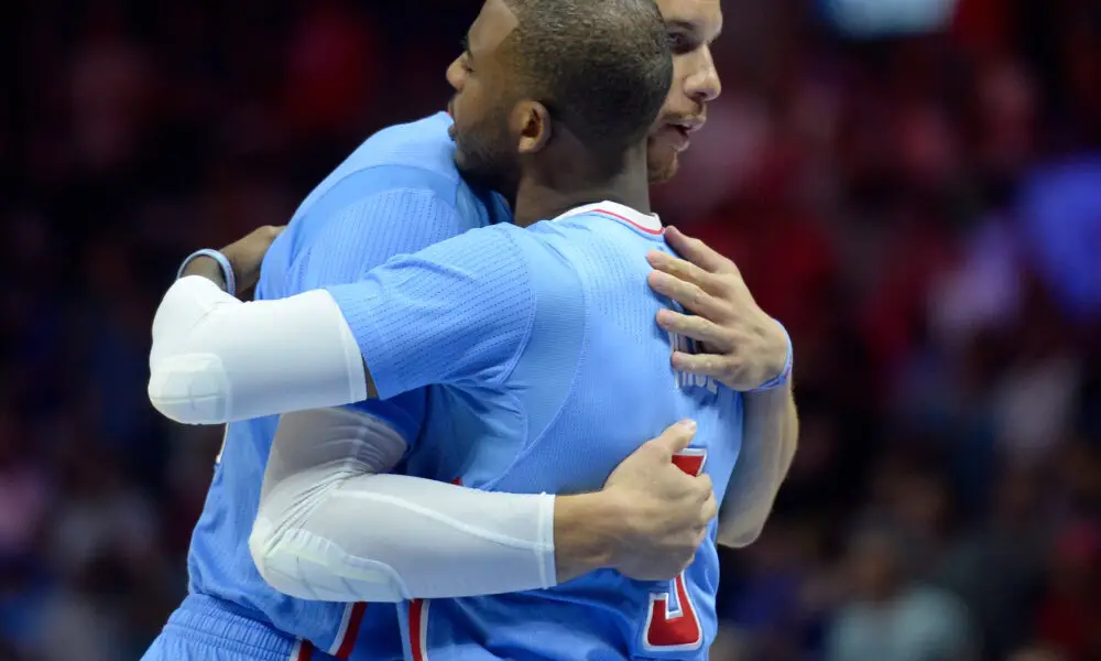 Mar 15, 2015; Los Angeles, CA, USA; Los Angeles Clippers forward Blake Griffin is embraced by teammate guard Chris Paul before the start of the Clippers game against the Houston Rockets at Staples Center. It was Griffin's first game back since Griffin had surgery to remove a staff infection in his elbow. Mandatory Credit: Robert Hanashiro-USA TODAY Sports
