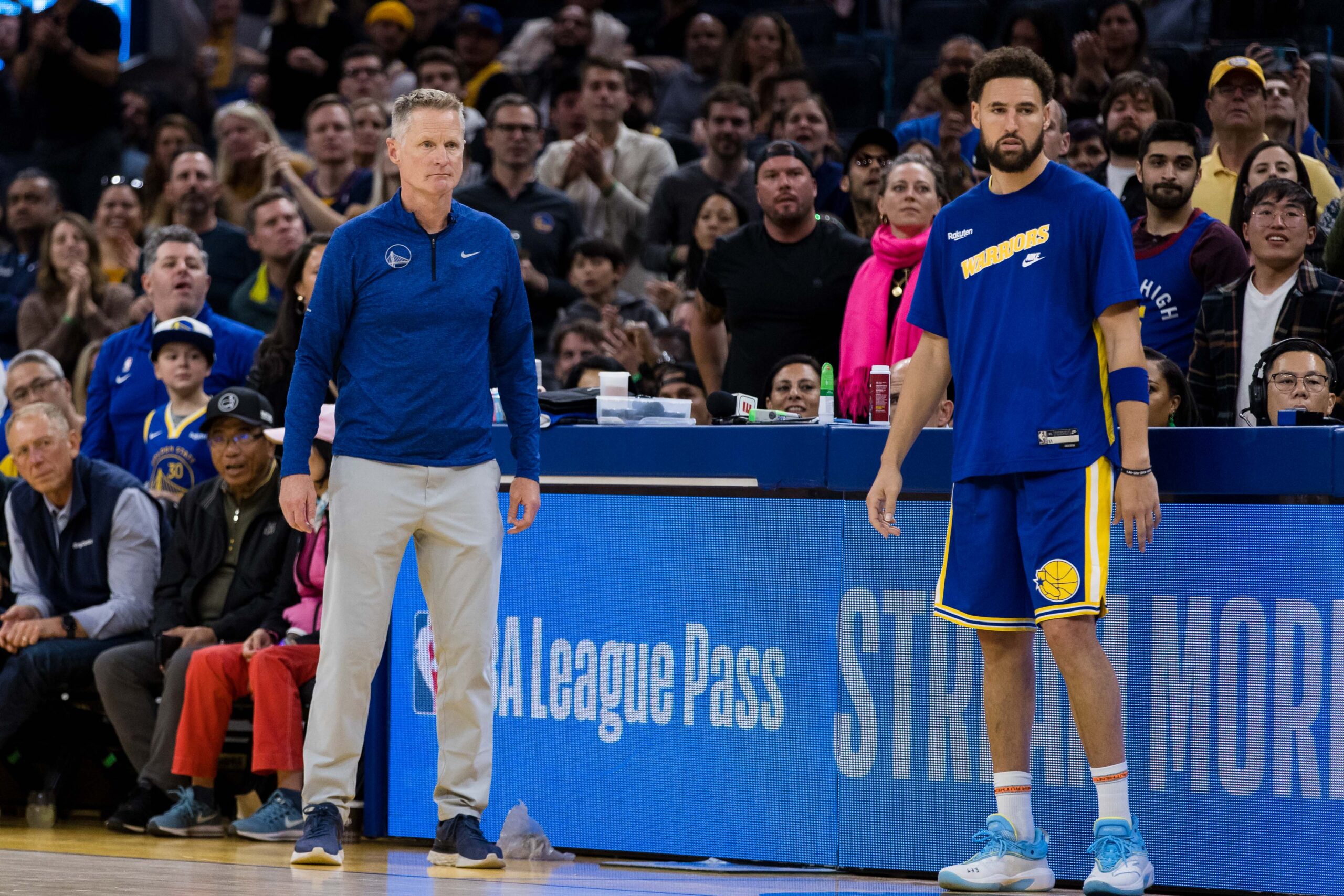 Oct 21, 2022; San Francisco, California, USA; Golden State Warriors head coach Steve Kerr and guard Klay Thompson (11) watch during the second half of the game against the Denver Nuggets at Chase Center. Mandatory Credit: John Hefti-USA TODAY Sports