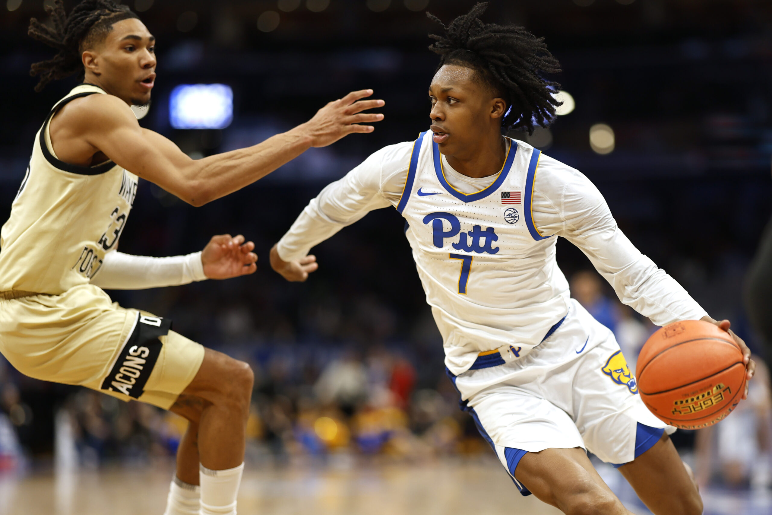 Mar 14, 2024; Washington, D.C., USA; Pittsburgh Panthers guard Carlton Carrington (7) drives to the basket as Wake Forest Demon Deacons guard Hunter Sallis (23) defends at Capital One Arena. Mandatory Credit: Geoff Burke-USA TODAY Sports