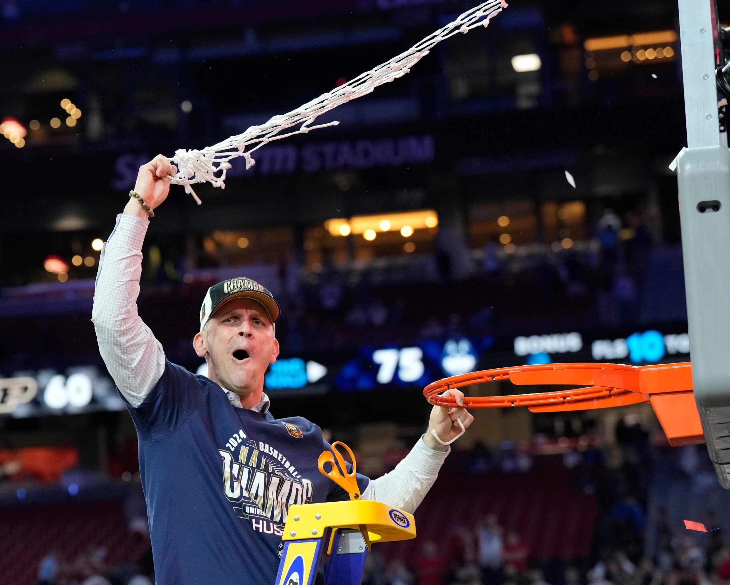 Connecticut Huskies head coach Dan Hurley cuts the basketball net winning the Men's NCAA national championship game against the Purdue Boilermakers at State Farm Stadium in Glendale on April 8, 2024