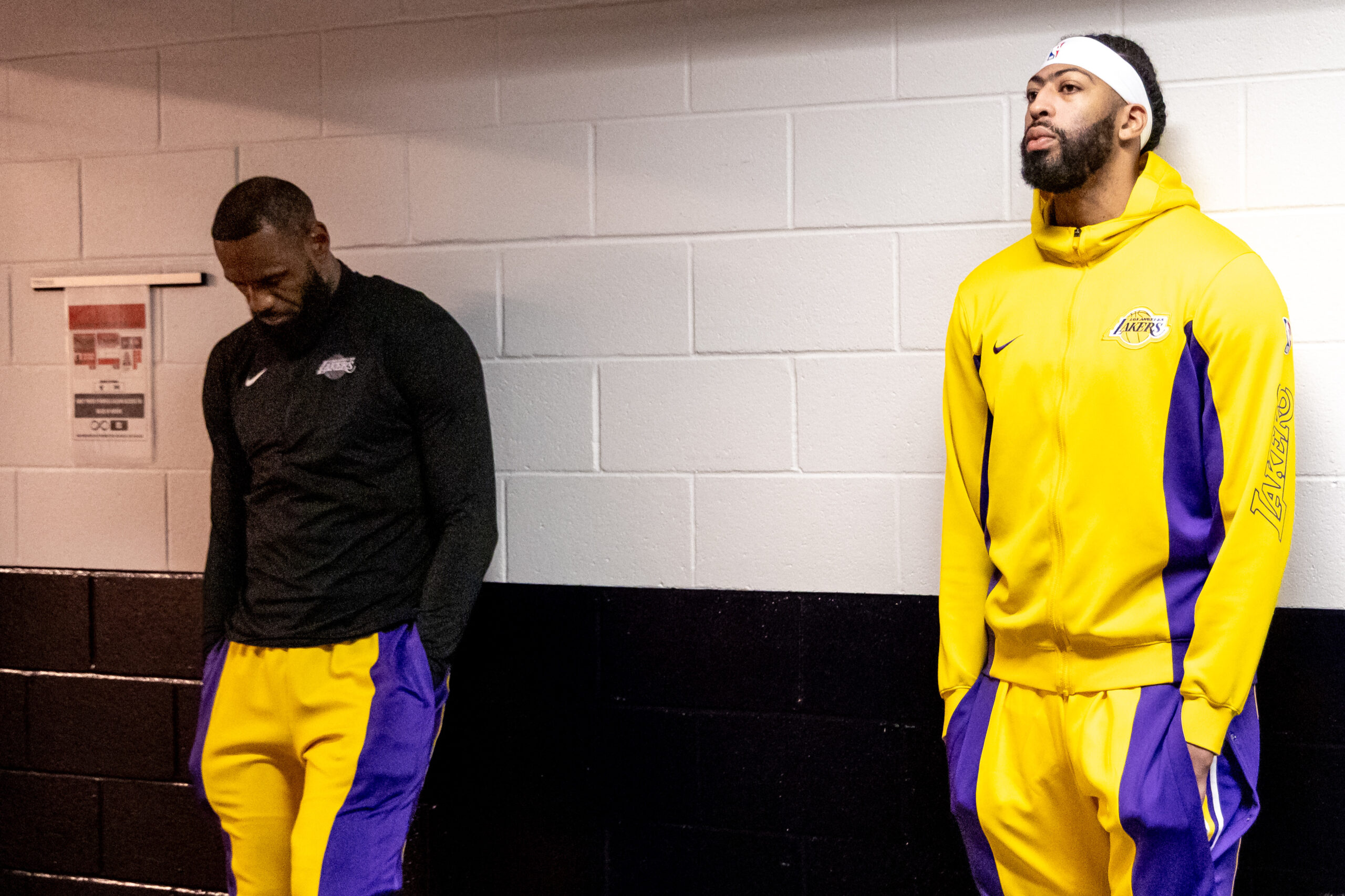 Apr 14, 2024; New Orleans, Louisiana, USA; Los Angeles Lakers forward LeBron James (23) and forward Anthony Davis (3) look on from the tunnel before the first half against the New Orleans Pelicans at Smoothie King Center. Mandatory Credit: Stephen Lew-USA TODAY Sports