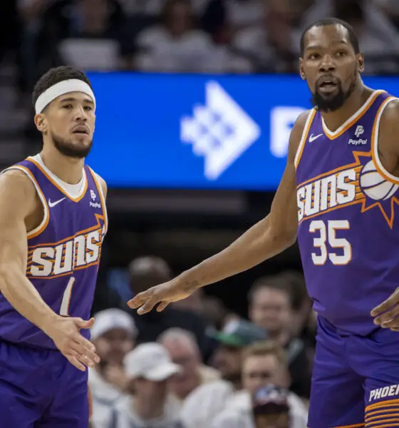 Apr 20, 2024; Minneapolis, Minnesota, USA; Phoenix Suns guard Devin Booker (1) shakes hands with forward Kevin Durant (35) against the Minnesota Timberwolves in the first half during game one of the first round for the 2024 NBA playoffs at Target Center. Mandatory Credit: Jesse Johnson-USA TODAY Sports