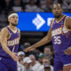 Apr 20, 2024; Minneapolis, Minnesota, USA; Phoenix Suns guard Devin Booker (1) shakes hands with forward Kevin Durant (35) against the Minnesota Timberwolves in the first half during game one of the first round for the 2024 NBA playoffs at Target Center. Mandatory Credit: Jesse Johnson-USA TODAY Sports
