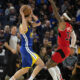 Jan 27, 2023; San Francisco, California, USA; Golden State Warriors guard Klay Thompson (11) looks to pass around Toronto Raptors guard Gary Trent Jr. (33) during the first quarter at Chase Center. Mandatory Credit: D. Ross Cameron-USA TODAY Sports