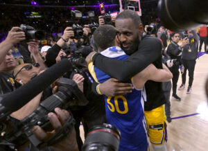 May 12, 2023; Los Angeles, California, USA; Los Angeles Lakers forward LeBron James (6) and Golden State Warriors guard Stephen Curry (30) embrace after game six of the 2023 NBA playoffs at Crypto.com Arena. Mandatory Credit: Jayne Kamin-Oncea-USA TODAY Sports