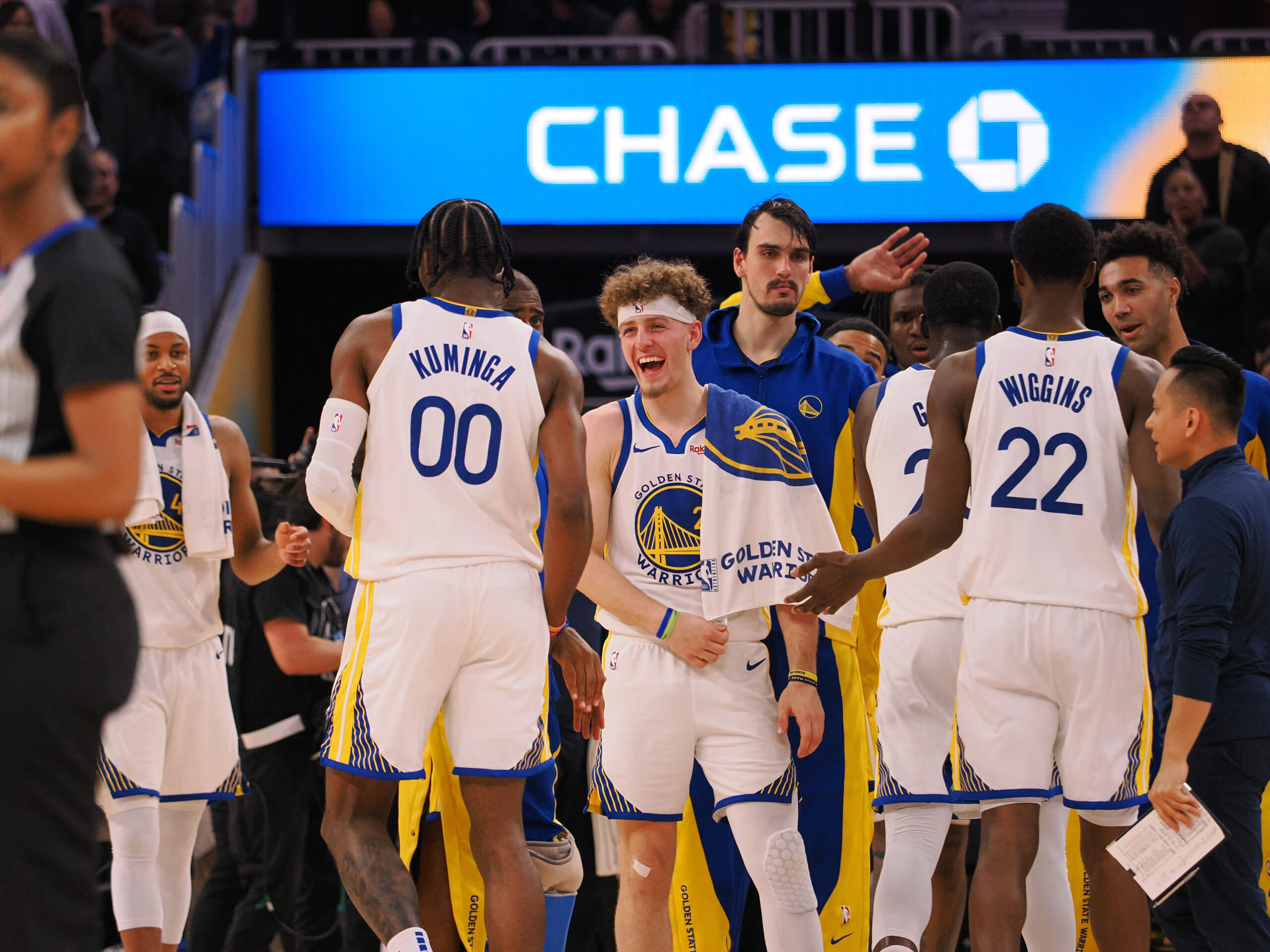 Dec 6, 2023; San Francisco, California, USA; Golden State Warriors guard Brandin Podziemski (2) celebrates with forward Jonathan Kuminga (00) after a time out is called against the Portland Trail Blazers during the fourth quarter at Chase Center. Mandatory Credit: Kelley L Cox-USA TODAY Sports