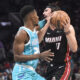 Dec 11, 2023; Charlotte, North Carolina, USA; Miami Heat forward Jaime Jaquez Jr. (11) drives into Charlotte Hornets forward guard Brandon Miller (24) during the first half at the Spectrum Center. Mandatory Credit: Sam Sharpe-USA TODAY Sports