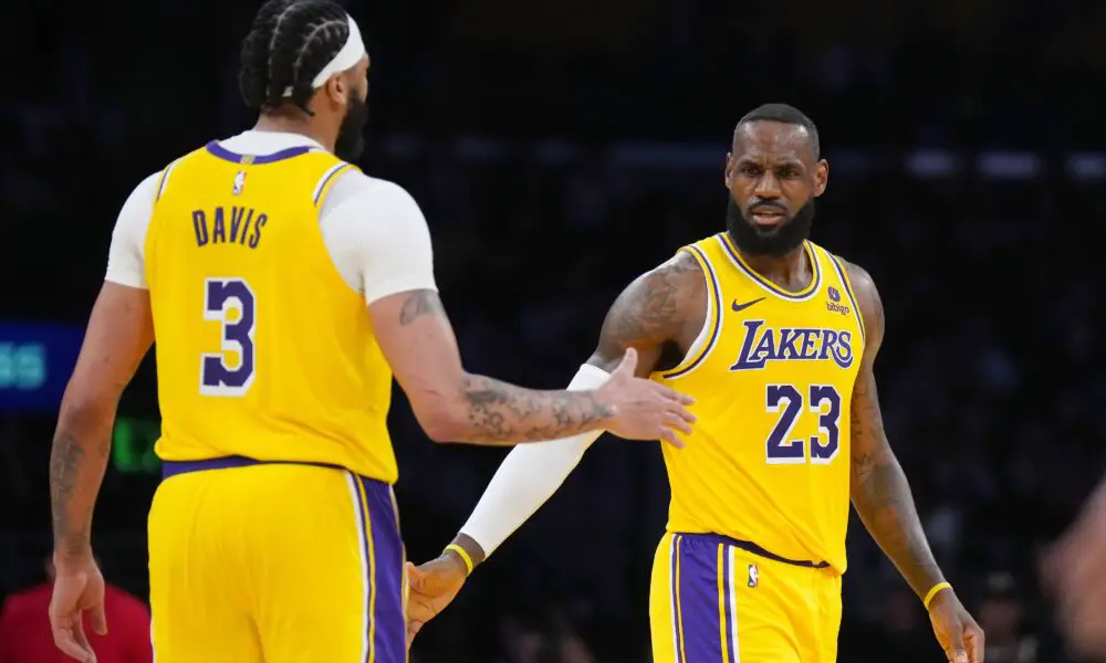 Mar 18, 2024; Los Angeles, California, USA; Los Angeles Lakers forward LeBron James (23) and forward Anthony Davis (3 celebrate against the Atlanta Hawks in the second half at Crypto.com Arena. Mandatory Credit: Kirby Lee-USA TODAY Sports