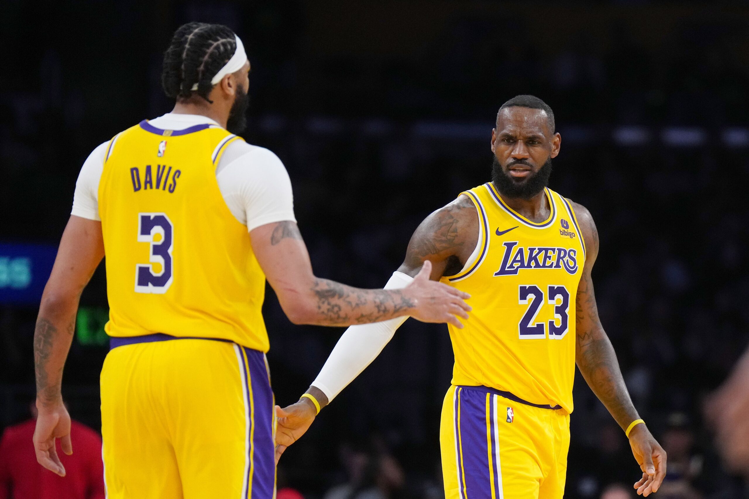 Mar 18, 2024; Los Angeles, California, USA; Los Angeles Lakers forward LeBron James (23) and forward Anthony Davis (3 celebrate against the Atlanta Hawks in the second half at Crypto.com Arena. Mandatory Credit: Kirby Lee-USA TODAY Sports