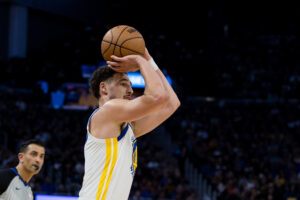 Mar 18, 2024; San Francisco, California, USA; Golden State Warriors guard Klay Thompson (11) takes a three-point shot against the New York Knicks during the second half at Chase Center. Mandatory Credit: John Hefti-USA TODAY Sports