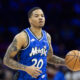 Apr 12, 2024; Philadelphia, Pennsylvania, USA; Orlando Magic guard Markelle Fultz (20) dribbles the ball against the Philadelphia 76ers during the second quarter at Wells Fargo Center. Mandatory Credit: Bill Streicher-USA TODAY Sports