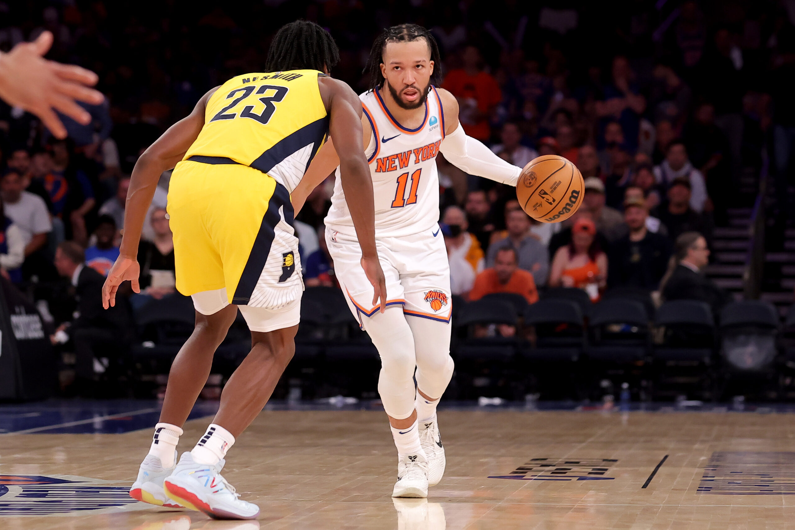 May 19, 2024; New York, New York, USA; New York Knicks guard Jalen Brunson (11) brings the ball up court against Indiana Pacers forward Aaron Nesmith (23) during the third quarter of game seven of the second round of the 2024 NBA playoffs at Madison Square Garden. Mandatory Credit: Brad Penner-USA TODAY Sports