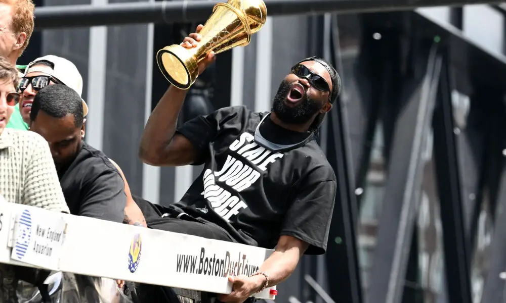 Jun 21, 2024; Boston, MA, USA; Boston Celtics guard Jaylen Brown (7) holds the MVP trophy during the 2024 NBA Championship parade in Boston. Mandatory Credit: Brian Fluharty-USA TODAY Sports