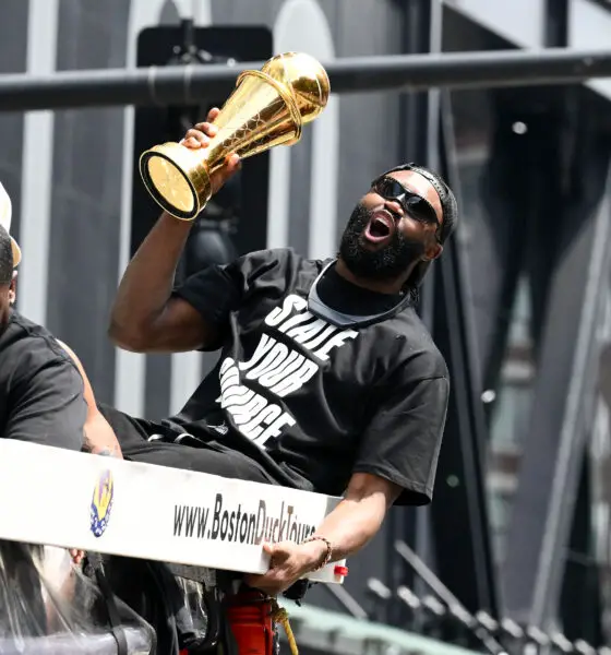 Jun 21, 2024; Boston, MA, USA; Boston Celtics guard Jaylen Brown (7) holds the MVP trophy during the 2024 NBA Championship parade in Boston. Mandatory Credit: Brian Fluharty-USA TODAY Sports