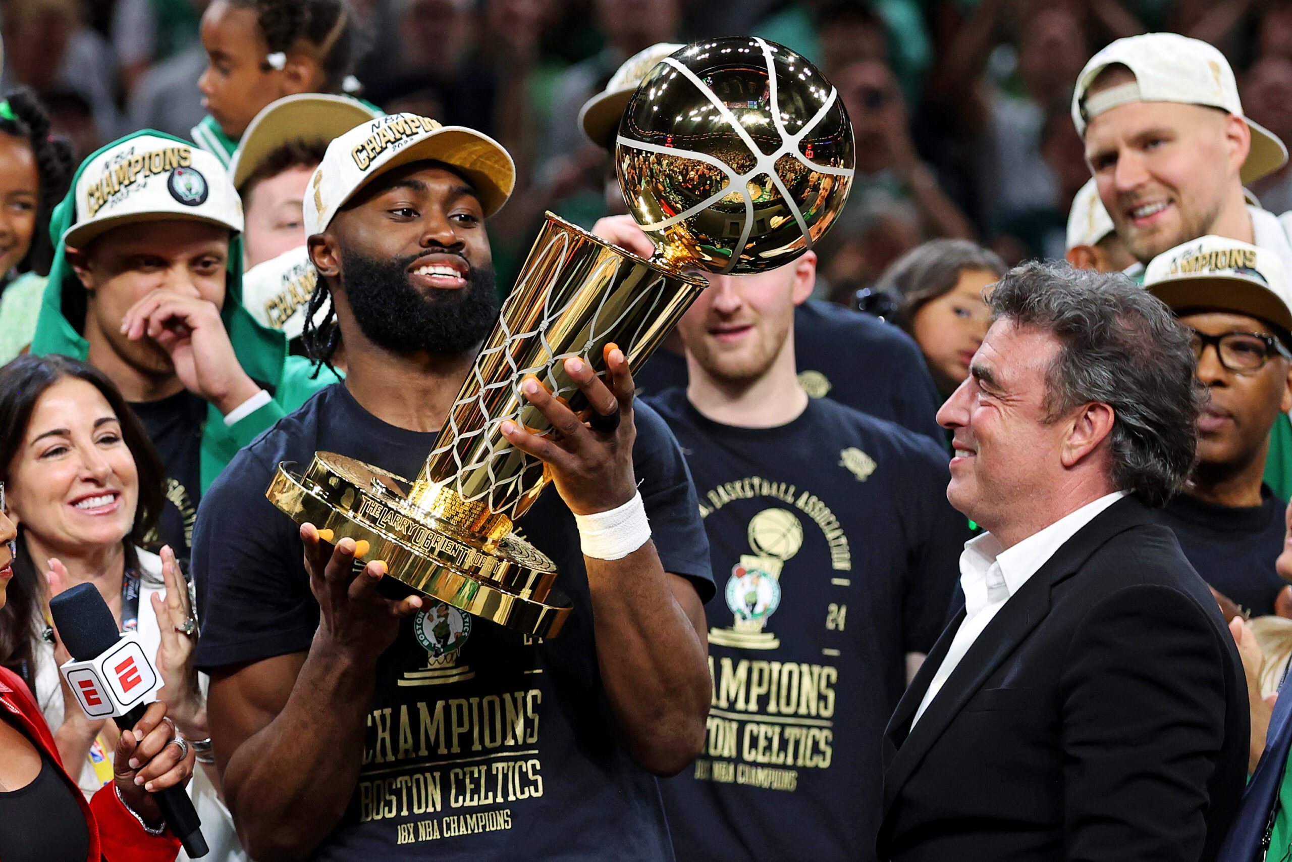 Jun 17, 2024; Boston, Massachusetts, USA; Boston Celtics guard Jaylen Brown (7) celebrates with the Larry O’Brien Trophy after beating the Dallas Mavericks in game five of the 2024 NBA Finals to win the NBA Championship at TD Garden. Mandatory Credit: Peter Casey-USA TODAY Sports