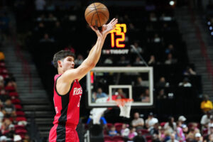 Jul 14, 2024; Las Vegas, NV, USA; Houston Rockets guard Reed Sheppard (15) shoots against the Washington Wizards during the third quarter at Thomas & Mack Center. Mandatory Credit: Stephen R. Sylvanie-USA TODAY Sports