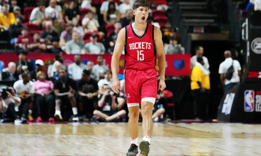 Jul 14, 2024; Las Vegas, NV, USA; Houston Rockets guard Reed Sheppard (15) reacts after scoring against the Washington Wizards during the third quarter at Thomas & Mack Center. Mandatory Credit: Stephen R. Sylvanie-USA TODAY Sports