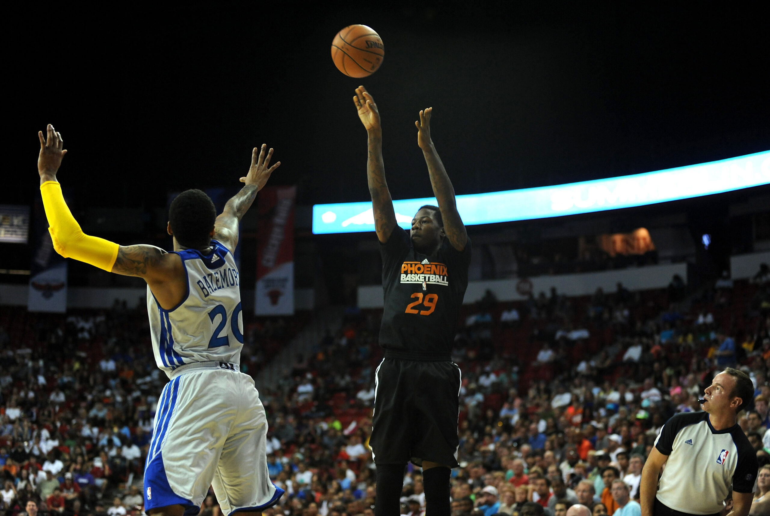 Jul 22, 2013; Las Vegas, NV, USA; Phoenix Suns guard Archie Goodwin lets a shot go over the defense of Golden State Warriors guard Kent Bazemore during the NBA Summer League Championship game at the Thomas and Mack Center. Mandatory Credit: Stephen R. Sylvanie-USA TODAY Sports