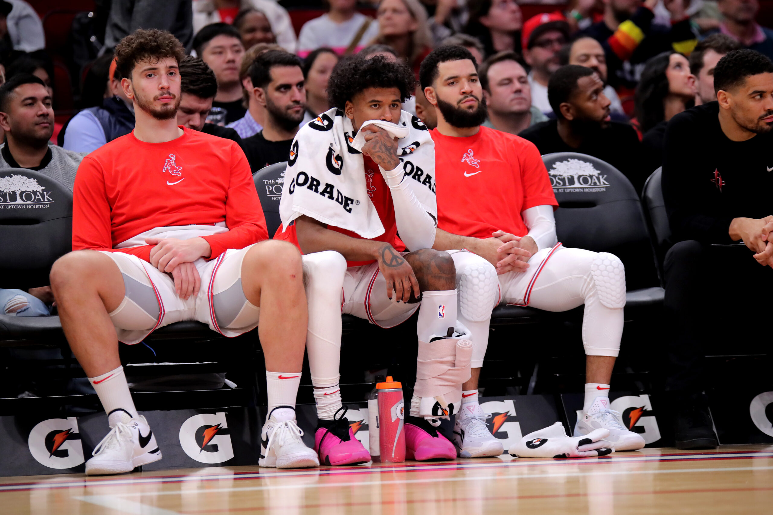 Dec 27, 2023; Houston, Texas, USA; (from L-to-R) Houston Rockets center Alperen Sengun (28), Houston Rockets guard Jalen Green (4) and Houston Rockets guard Fred VanVleet (5) sit on the bench during the fourth quarter against the Phoenix Suns at Toyota Center. Mandatory Credit: Erik Williams-USA TODAY Sports